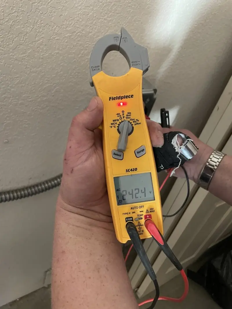 Voltage testing with clamp meter during Whole House Surge Protector in Sharpsburg